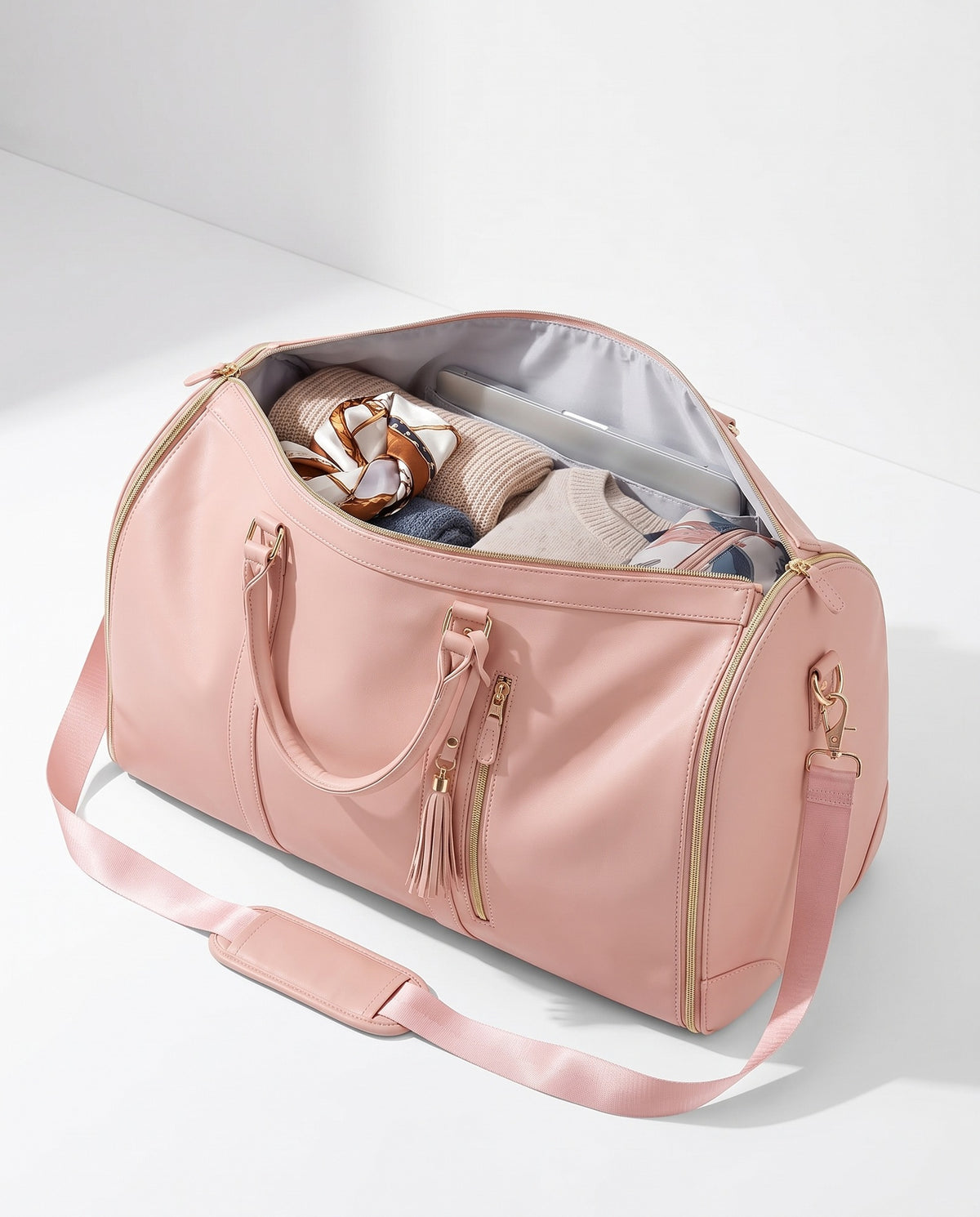 The OneBag in Blush and Champagne — packed interior; contents shown for styling.
