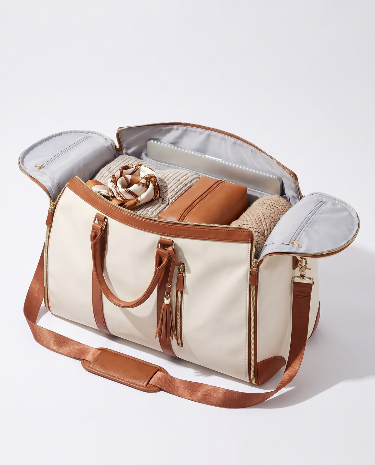 The OneBag in Ivory & Cognac — packed interior; contents shown for styling.