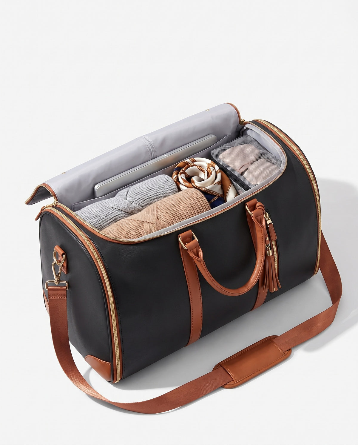 The OneBag in Noir Voyage — packed interior; contents shown for styling.