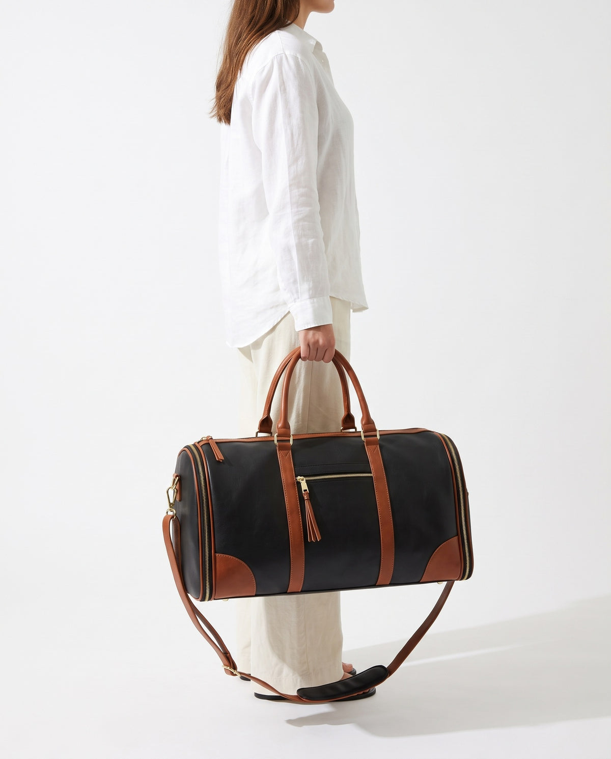 The OneBag in Noir Voyage — carried for scale.