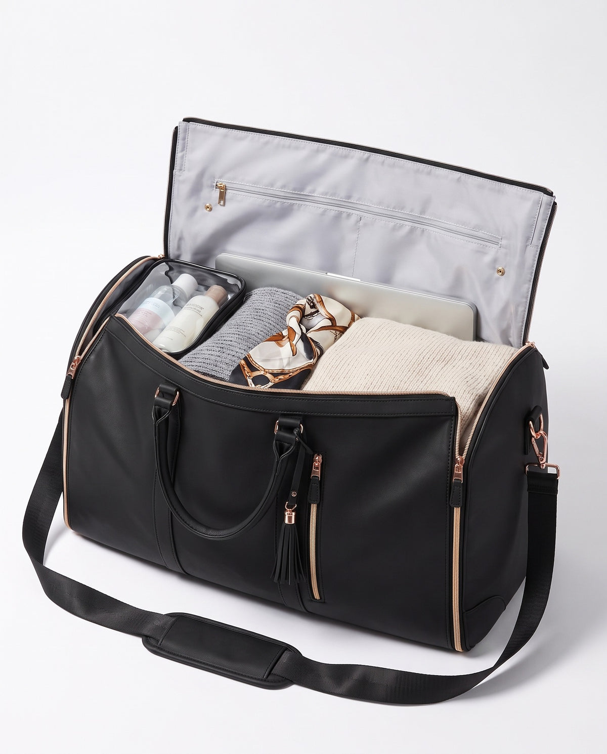 The OneBag in Onyx & Gold — packed interior; contents shown for styling.